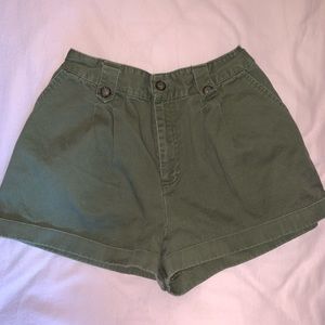 Pleated olive shorts.
